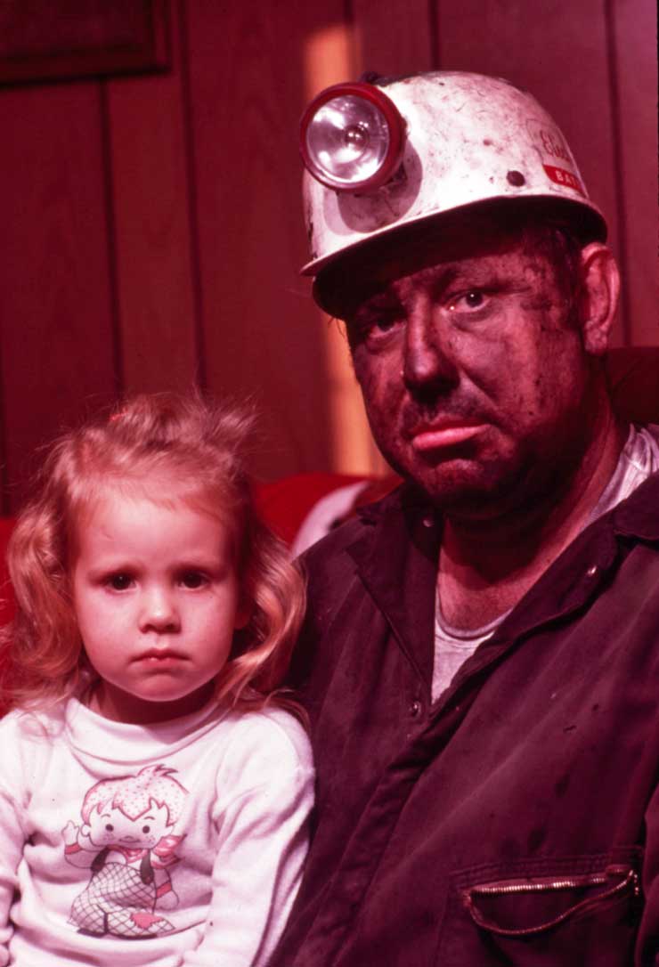 Coal miner with his young daughter
