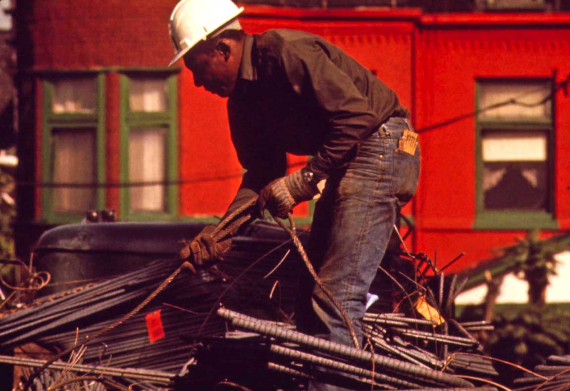 Man hauling rebar