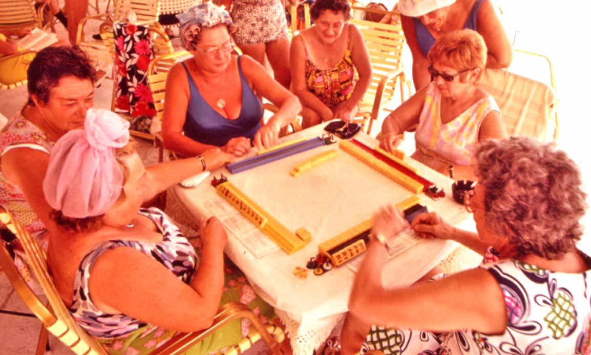 Group of elderly women playing mah-jongg